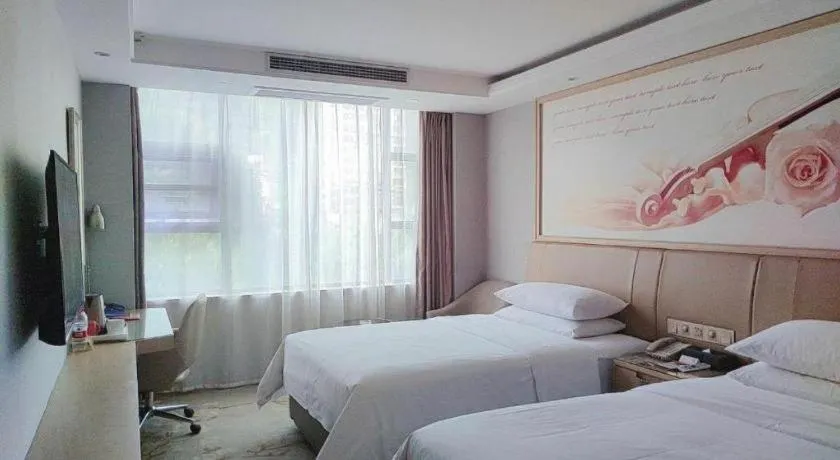 Bed in Vienna Hotel Guangxi Hechi Jinchengjiang Baima Street