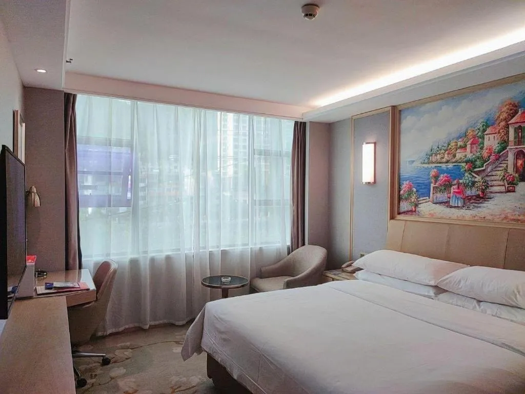 Bed in Vienna Hotel Guangxi Hechi Jinchengjiang Baima Street