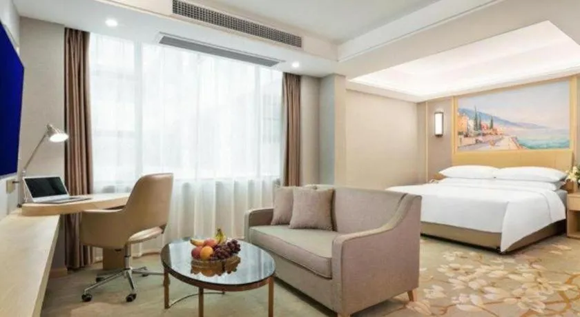 Bed in Vienna Hotel Guangxi Hechi Jinchengjiang Baima Street