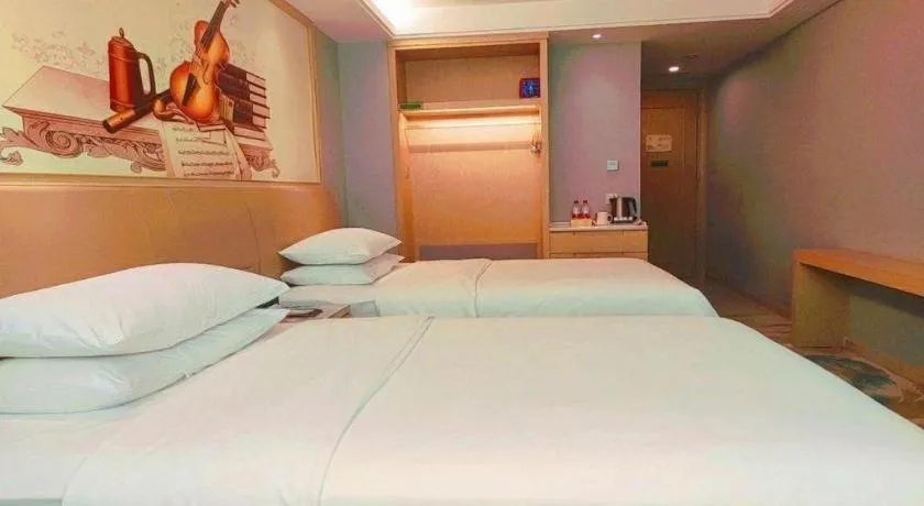 Bed in Vienna Hotel Guangxi Hechi Jinchengjiang Baima Street