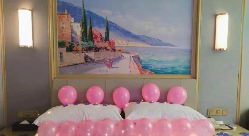 Bed in Vienna Hotel Guangxi Hechi Jinchengjiang Baima Street