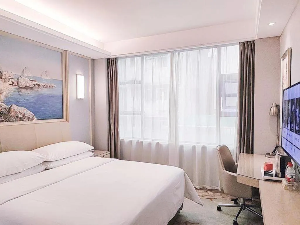 Bed in Vienna Hotel Guangxi Hechi Jinchengjiang Baima Street