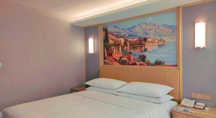 Bed in Vienna Hotel Guangxi Hechi Jinchengjiang Baima Street