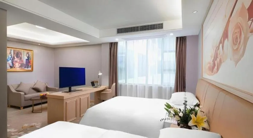 Bed in Vienna Hotel Guangxi Hechi Jinchengjiang Baima Street