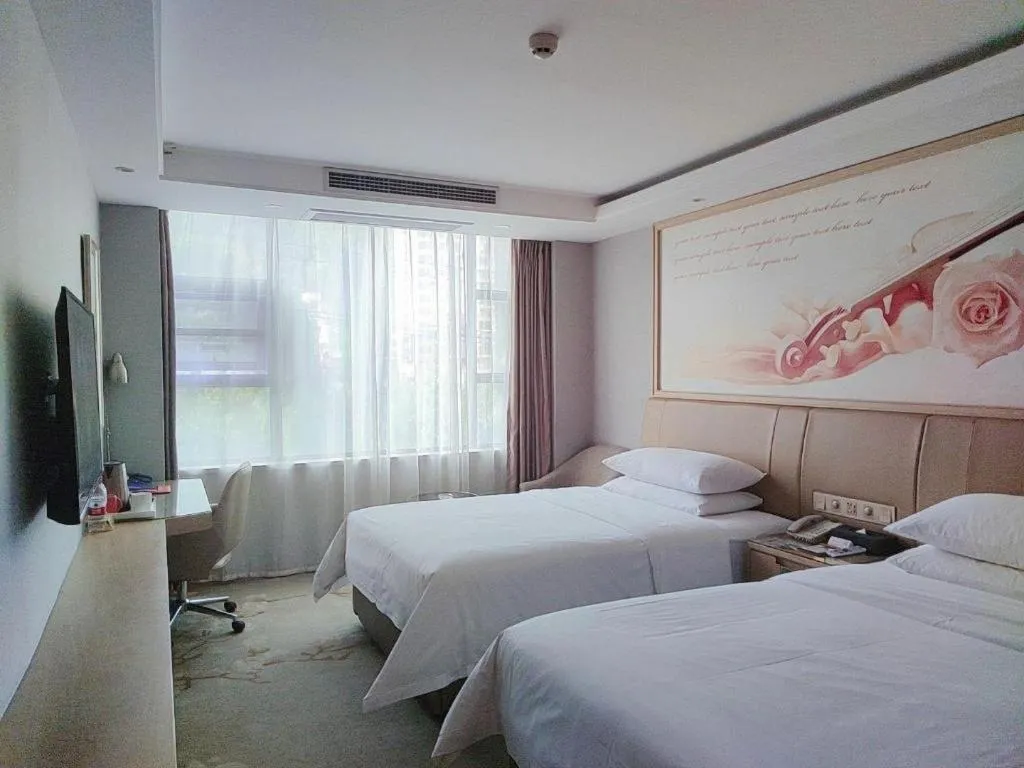 Bed in Vienna Hotel Guangxi Hechi Jinchengjiang Baima Street