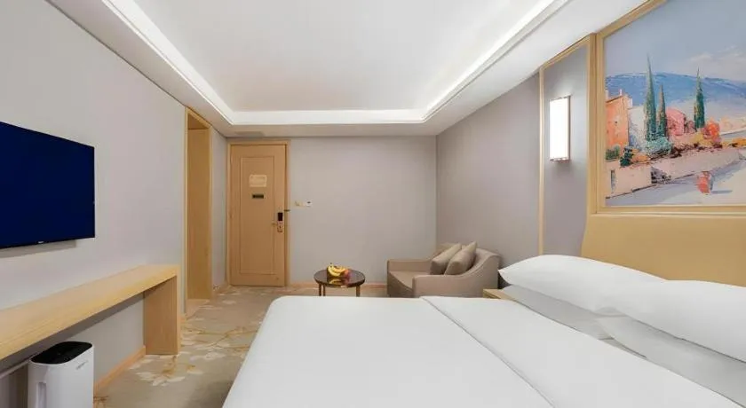 Bed in Vienna Hotel Guangxi Hechi Jinchengjiang Baima Street