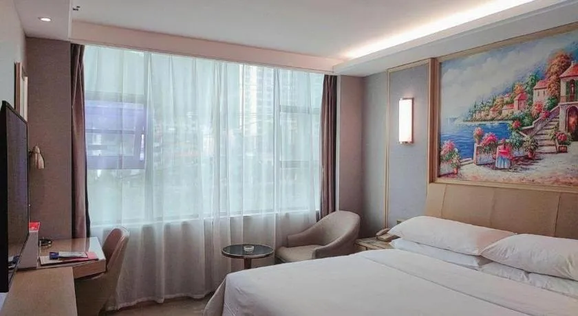 Bed in Vienna Hotel Guangxi Hechi Jinchengjiang Baima Street
