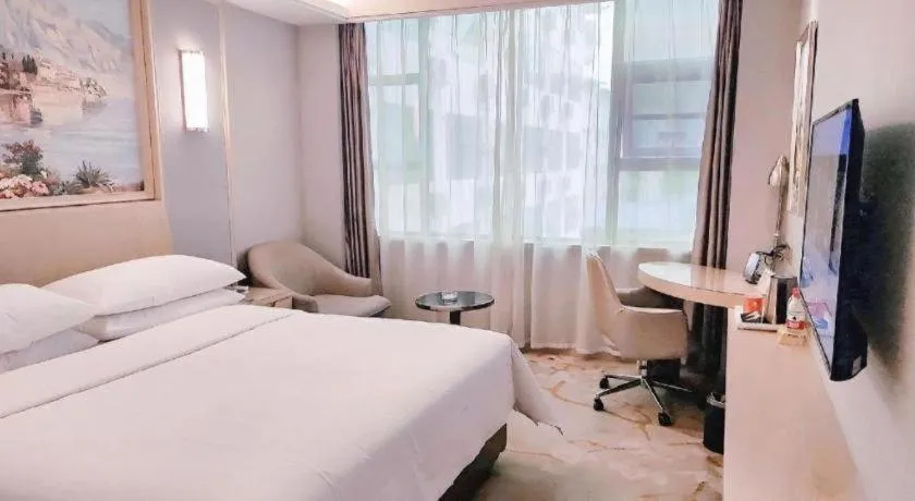 Bed in Vienna Hotel Guangxi Hechi Jinchengjiang Baima Street