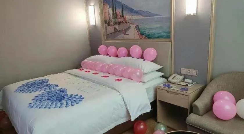 Bed in Vienna Hotel Guangxi Hechi Jinchengjiang Baima Street