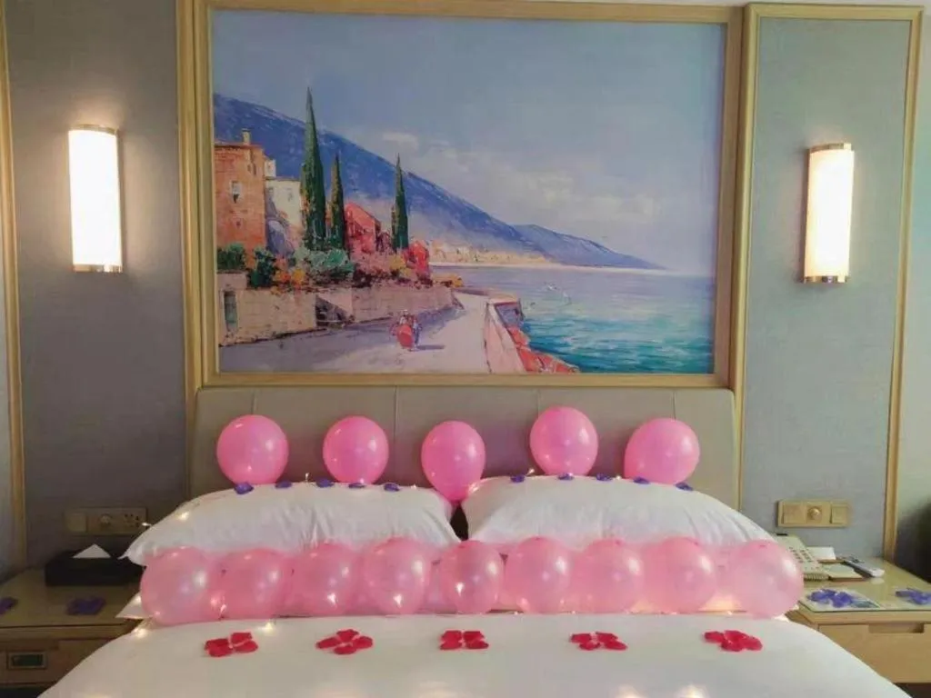 Bed in Vienna Hotel Guangxi Hechi Jinchengjiang Baima Street