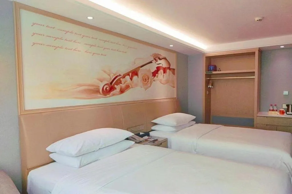 Bed in Vienna Hotel Guangxi Hechi Jinchengjiang Baima Street