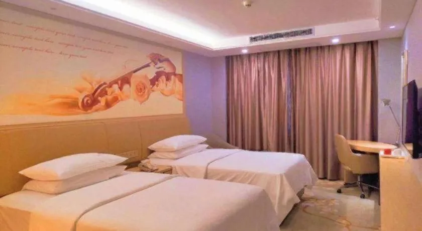 Bed in Vienna Hotel Guangxi Hechi Jinchengjiang Baima Street