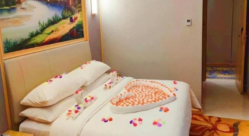 Bed in Vienna Hotel Guangxi Hechi Jinchengjiang Baima Street