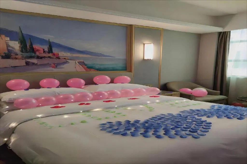 Bed in Vienna Hotel Guangxi Hechi Jinchengjiang Baima Street