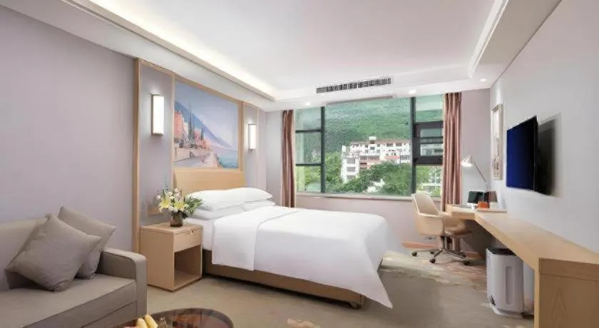 Bed in Vienna Hotel Guangxi Hechi Jinchengjiang Baima Street