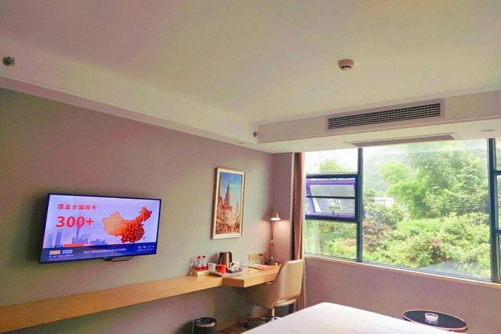 Bed in Vienna Hotel Guangxi Hechi Jinchengjiang Baima Street