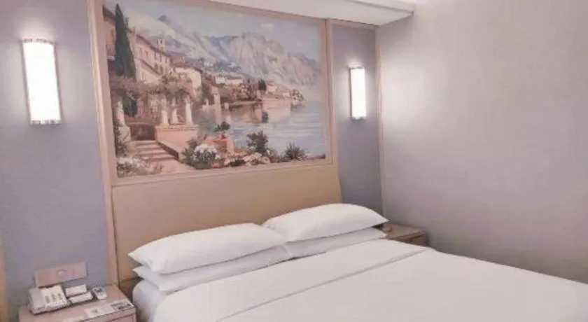 Bed in Vienna Hotel Guangxi Hechi Jinchengjiang Baima Street