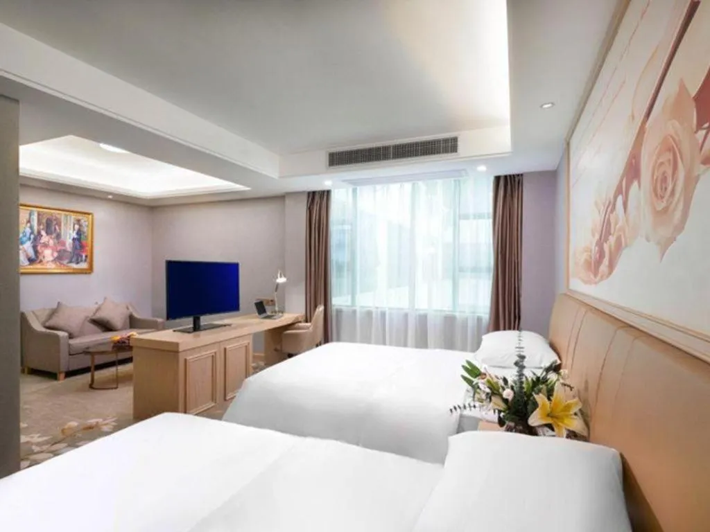 Bed in Vienna Hotel Guangxi Hechi Jinchengjiang Baima Street