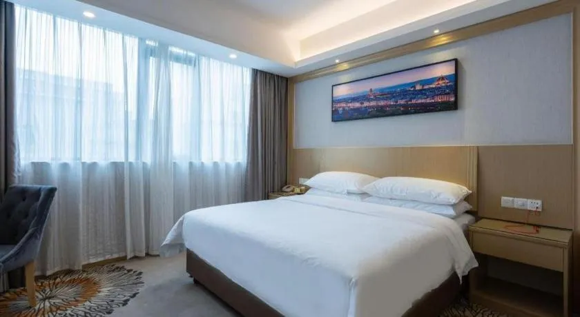 Bed in Vienna Hotel Guangzhou Huadu Financial Center Sunac Amusement Park