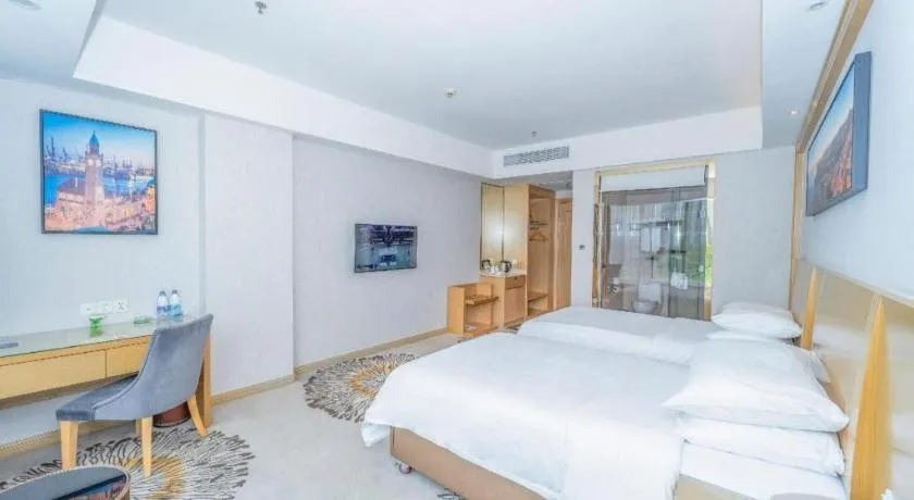 Bed in Vienna Hotel Guangzhou Huadu Financial Center Sunac Amusement Park