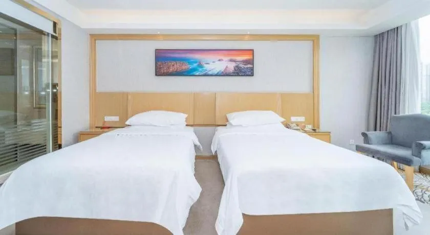 Bed in Vienna Hotel Guangzhou Huadu Financial Center Sunac Amusement Park
