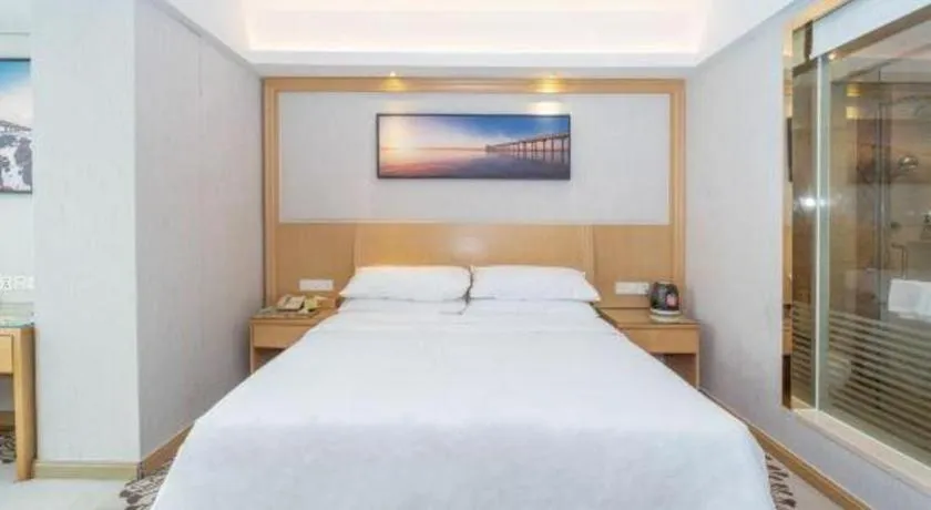 Bed in Vienna Hotel Guangzhou Huadu Financial Center Sunac Amusement Park