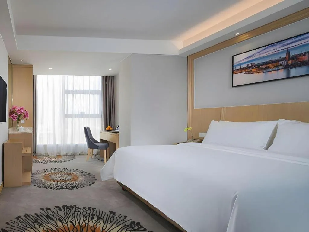 Bed in Vienna Hotel Guangzhou Huadu Financial Center Sunac Amusement Park