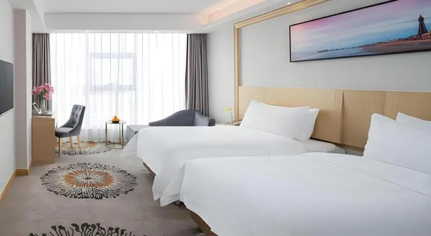 Bed in Vienna Hotel Guangzhou Huadu Financial Center Sunac Amusement Park