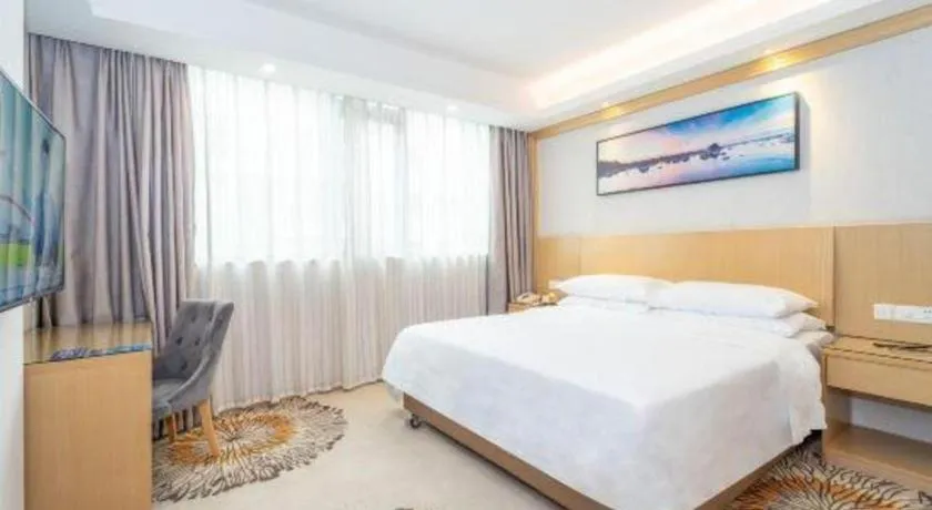 Bed in Vienna Hotel Guangzhou Huadu Financial Center Sunac Amusement Park