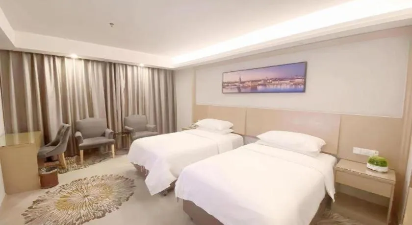 Bed in Vienna Hotel Guangzhou Huadu Financial Center Sunac Amusement Park