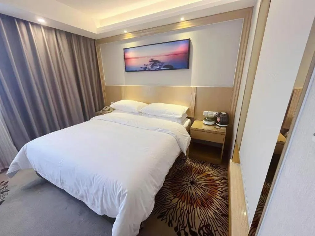 Bed in Vienna Hotel Guangzhou Huadu Financial Center Sunac Amusement Park