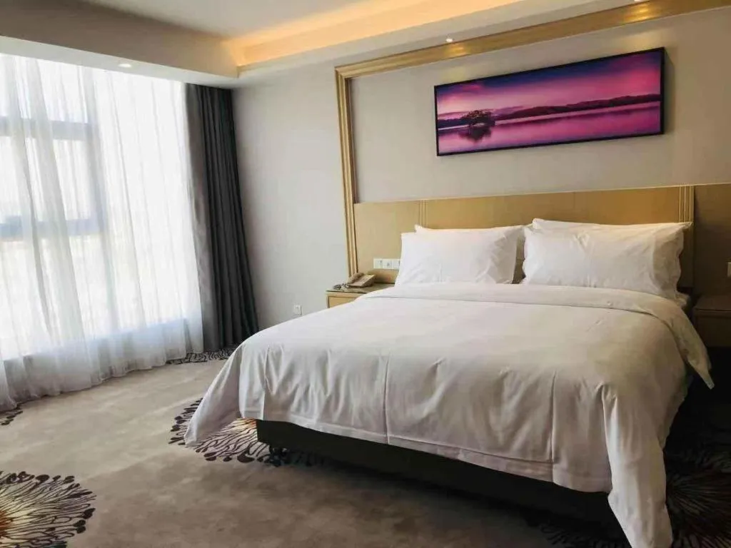 Bed in Vienna Hotel Guangzhou Huadu Financial Center Sunac Amusement Park