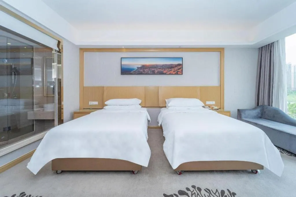 Bed in Vienna Hotel Guangzhou Huadu Financial Center Sunac Amusement Park