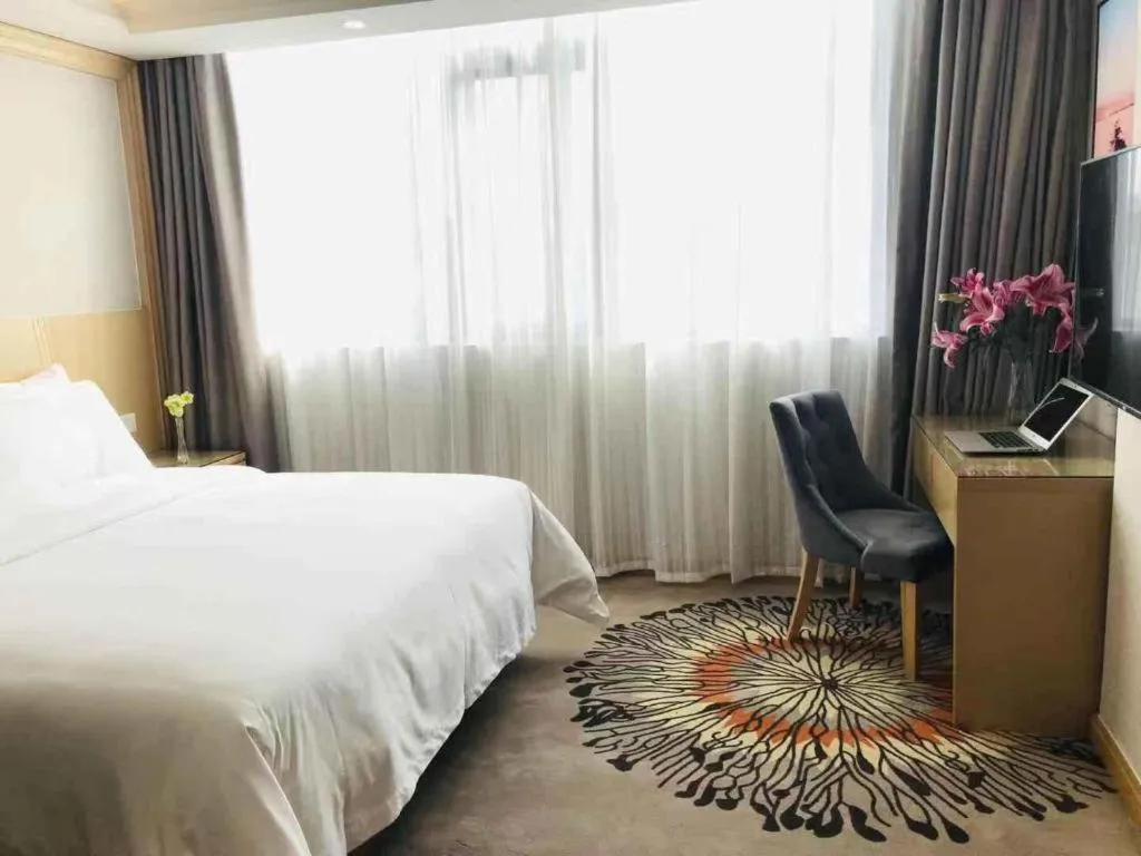 Bed in Vienna Hotel Guangzhou Huadu Financial Center Sunac Amusement Park
