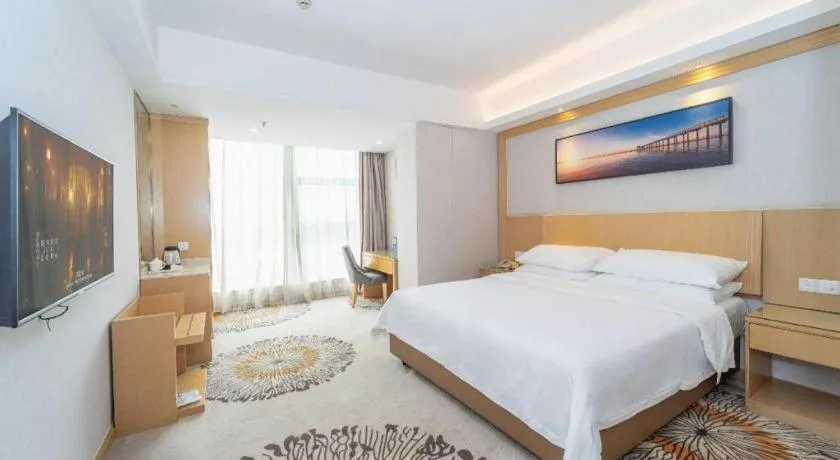 Bed in Vienna Hotel Guangzhou Huadu Financial Center Sunac Amusement Park