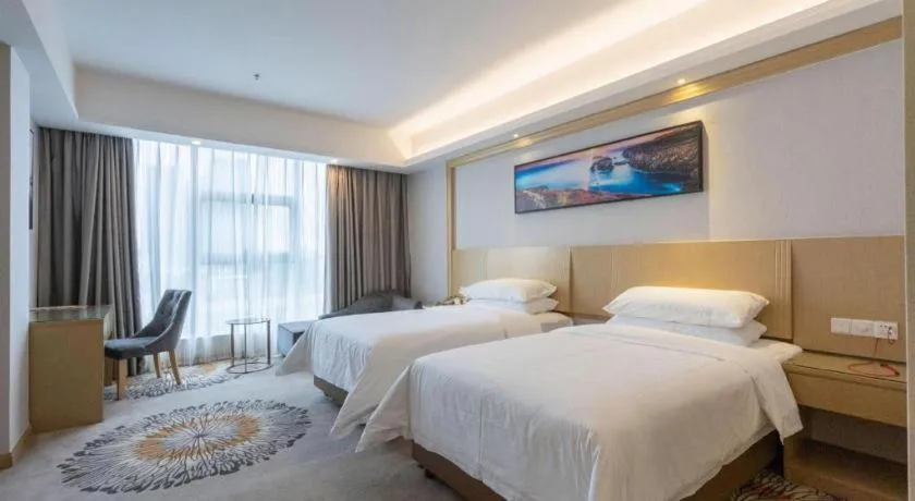 Bed in Vienna Hotel Guangzhou Huadu Financial Center Sunac Amusement Park