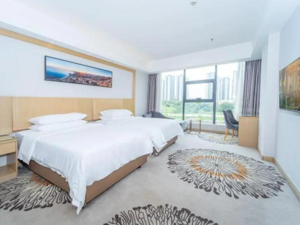 Bed in Vienna Hotel Guangzhou Huadu Financial Center Sunac Amusement Park