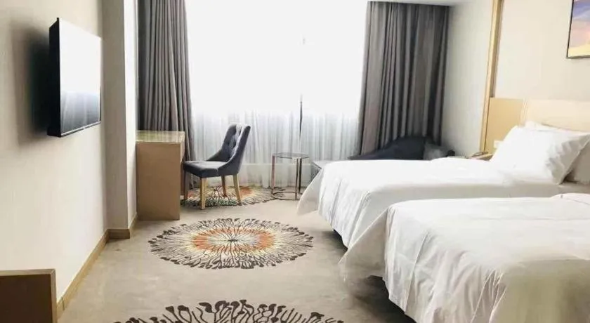 Bed in Vienna Hotel Guangzhou Huadu Financial Center Sunac Amusement Park