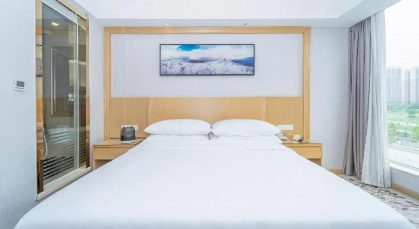 Bed in Vienna Hotel Guangzhou Huadu Financial Center Sunac Amusement Park