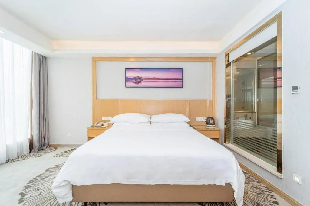 Bed in Vienna Hotel Guangzhou Huadu Financial Center Sunac Amusement Park