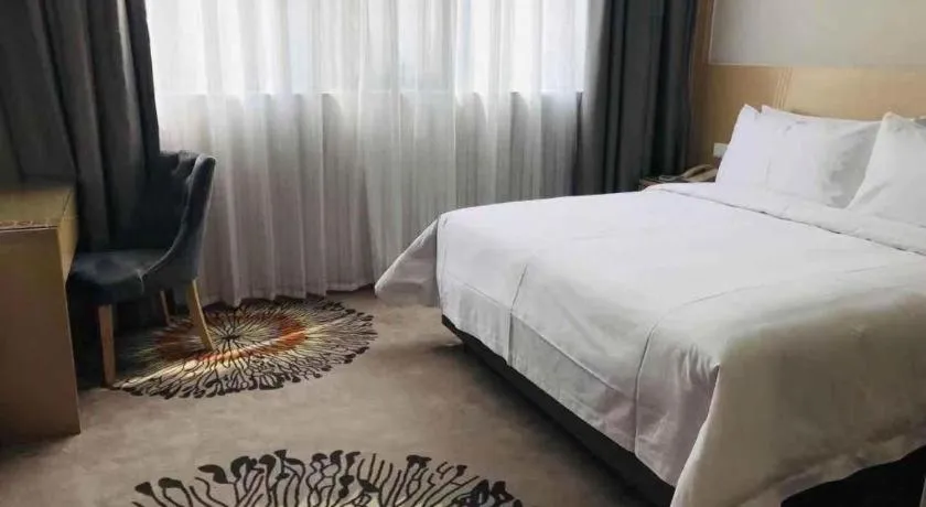 Bed in Vienna Hotel Guangzhou Huadu Financial Center Sunac Amusement Park