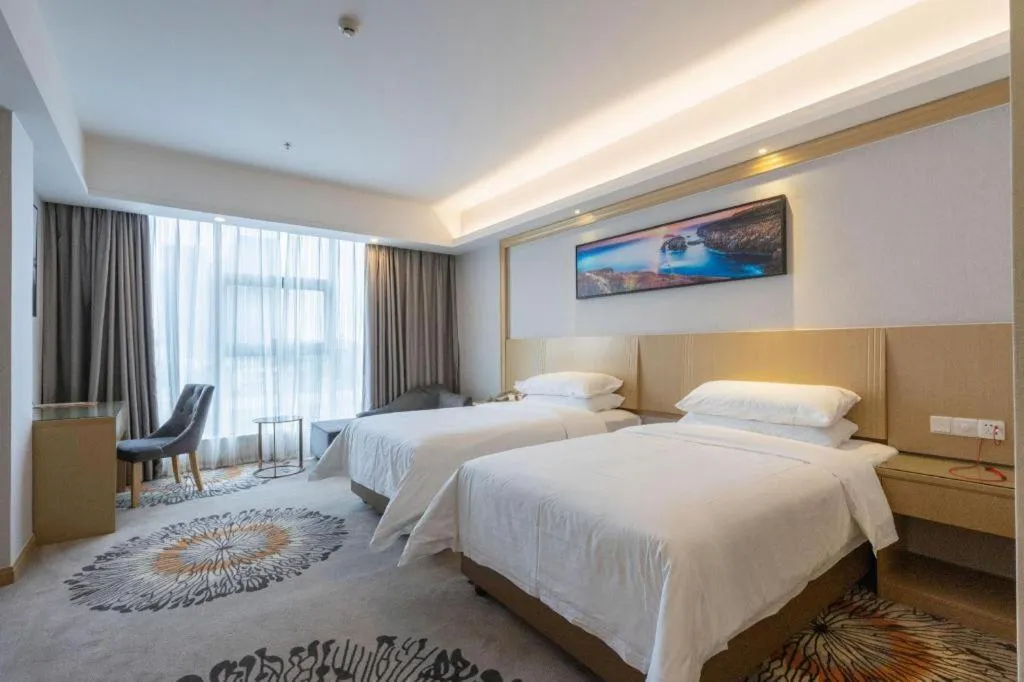 Bed in Vienna Hotel Guangzhou Huadu Financial Center Sunac Amusement Park