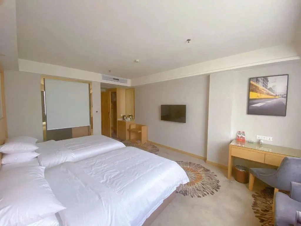 Bed in Vienna Hotel Guangzhou Huadu Financial Center Sunac Amusement Park