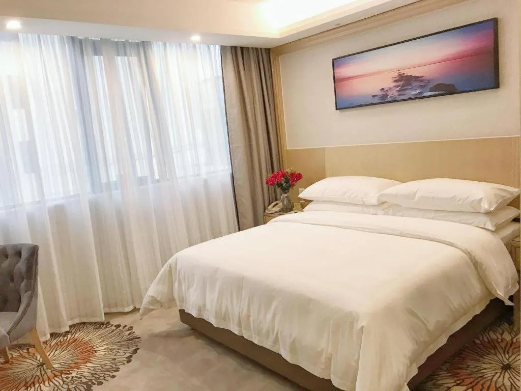 Bed in Vienna Hotel Guangzhou Huadu Financial Center Sunac Amusement Park