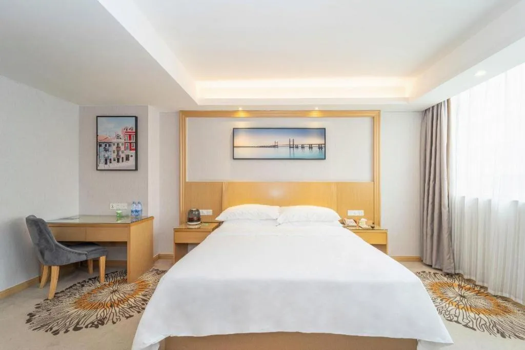 Bed in Vienna Hotel Guangzhou Huadu Financial Center Sunac Amusement Park