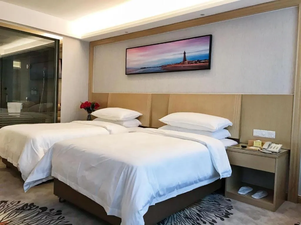 Bed in Vienna Hotel Guangzhou Huadu Financial Center Sunac Amusement Park