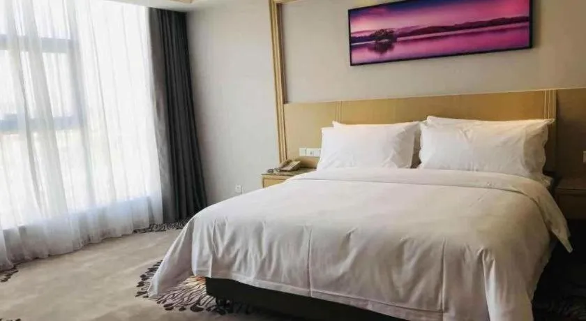 Bed in Vienna Hotel Guangzhou Huadu Financial Center Sunac Amusement Park