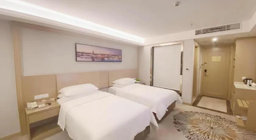 Bed in Vienna Hotel Guangzhou Huadu Financial Center Sunac Amusement Park