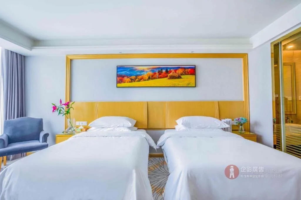 Bed in Vienna Hotel Guangzhou Huadu Financial Center Sunac Amusement Park