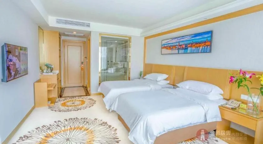 Bed in Vienna Hotel Guangzhou Huadu Financial Center Sunac Amusement Park